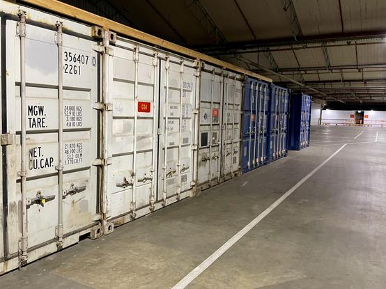 A warehouse with shipping conatiners.