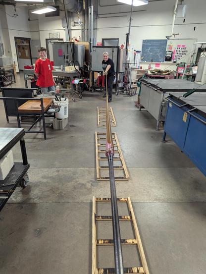Skye at the other end of the post while Amber nods in approval at my rusty hot shop bubble stretching skills