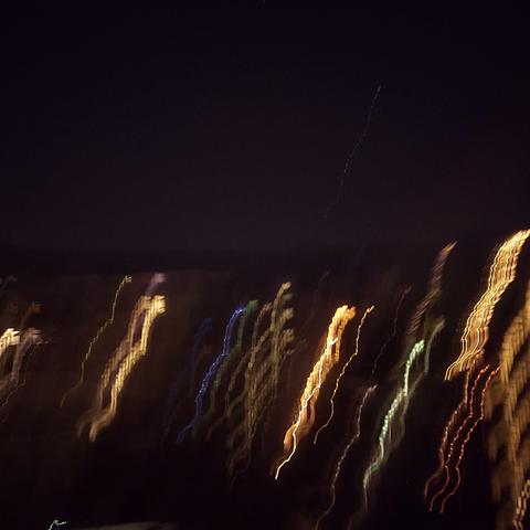 Blurred lights of city houses.