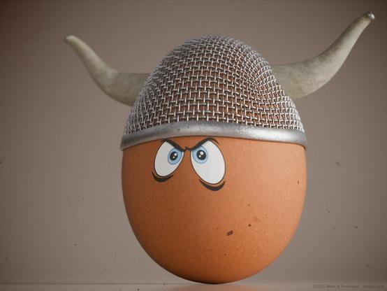 Brown hens egg with a grill helmet with small horns and serious cartoon eyes on the front of the egg.