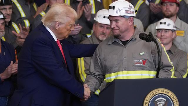 President Donald Trump shakes hands with coal miner Jeff Crowe during an event on energy production in the East Room of the White House, Tuesday, April 8, 2025, in Washington. (AP Photo/Alex Brandon)